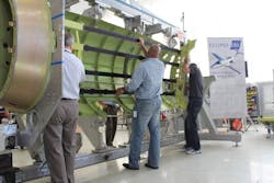 Content Dam Avi Online Articles 2012 06 Eai Staff Perform First Fuselage Assembly Sn1001 Content Dam Avi Online Articles 2012 06 Eai Staff Perform First Fuselage Assembly Sn1001