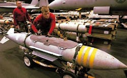 Navy F/A-18 combat jets being fitted for laser-guided JDAM smart bombs to attack moving targets Navy F/A-18 combat jets being fitted for laser-guided JDAM smart bombs to attack moving targets