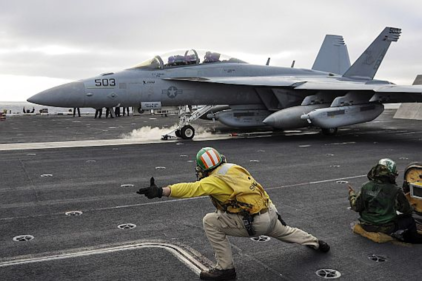 U.S. Navy aircraft carrier flight deck crews use computer simulation to