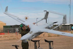 U.S. Marine Corps Lance Cpl. Isaiah Trujillo, an unmanned aircraft system maintenance technician, recovers a U.S. Marine Corps RQ-21A Blackjack unmanned aircraft at Canon Air Defense Complex in Yuma, Ariz.