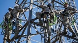 U.S. Air Force RF and microwave technicians rappel down a radio antenna tower during an immersion tour at Moody Air Force Base, Ga.