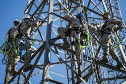 U.S. Air Force RF and microwave technicians rappel down a radio antenna tower during an immersion tour at Moody Air Force Base, Ga.