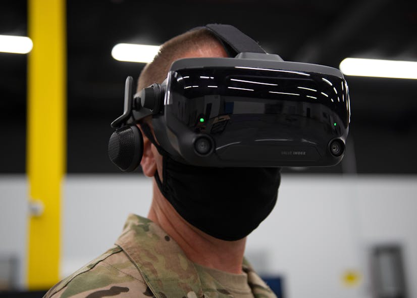 Chief Master Sgt. Courtney Freeman, 1st Special Operations Wing command chief, uses a virtual reality headset during the FieldWerx military open event in Fort Walton Beach, Fla., Aug. 24, 2020. VR is used across the force to provide training to Airmen on how to maintain aircraft, fly remotely piloted aircraft, or perform other technical tasks in a safe environment.
