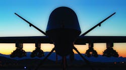 An MQ-9A Reaper sits on the ramp at Creech Air Force Base, Nev., in the first flight test of the MQ-9 carrying eight Hellfire missiles.