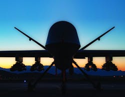 An MQ-9A Reaper sits on the ramp at Creech Air Force Base, Nev., in the first flight test of the MQ-9 carrying eight Hellfire missiles.