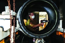 An aviation machinist’s mate aboard the aircraft carrier USS Abraham Lincoln performs a liquid crystal test to reveal possible delamination of an engine run trailer. An aviation machinist’s mate aboard the aircraft carrier USS Abraham Lincoln performs a liquid crystal test to reveal possible delamination of an engine run trailer.