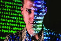 An Air Force cyber-warfare specialist serving with the 175th Cyberspace Operations Group of the Maryland Air National Guard works at Warfield Air National Guard Base, in Middle River, Md.