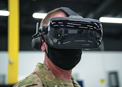 A U.S. Air Force chief master sergeant uses a virtual reality headset, which can provide training on how to maintain aircraft, fly remotely piloted aircraft, or perform other technical tasks in a safe environment.
