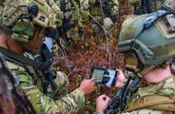 Special Operations cyber warfighters upload coordinates during an exercise showcasing the capabilities of the Advanced Battle Management System. Cyber security is crucial for sensitive battle-management systems.