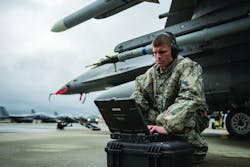 U.S. Air Force Staff Sgt. Zackery Coder checks computer data during Red Flag-Alaska 14-2, June 19, 2014, on Eielson Air Force Base, Alaska.