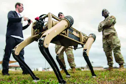Airmen watch a test of an unmanned ground vehicle at Tyndall Air Force Base, Fla., as part of a plan to use the “computerized canines” to aid in reconnaissance and enhanced security patrolling operations across the base. Airmen watch a test of an unmanned ground vehicle at Tyndall Air Force Base, Fla., as part of a plan to use the “computerized canines” to aid in reconnaissance and enhanced security patrolling operations across the base.