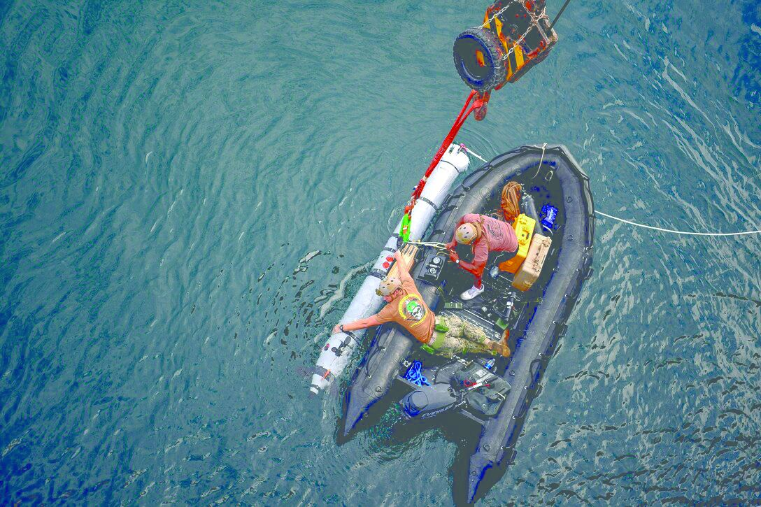 Sailors prepare an unmanned underwater vehicle in the Persian Gulf during Mine Countermeasures Exercise 19-1, a training event with the British Royal Navy.
