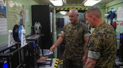 U.S. Marine Corps technicians discuss the process of producing mask frames and face shields for use in the fight against COVID-19.