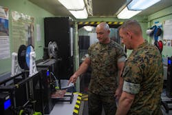 U.S. Marine Corps technicians discuss the process of producing mask frames and face shields for use in the fight against COVID-19. U.S. Marine Corps technicians discuss the process of producing mask frames and face shields for use in the fight against COVID-19.