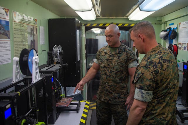 U.S. Marine Corps technicians discuss the process of producing mask frames and face shields for use in the fight against COVID-19.
