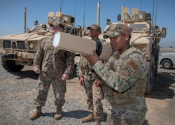 Members of the 380th Expeditionary Security Forces Squadron demonstrate an RF and microwave GPS signal jammer to counter small unmanned aerial systems on Al Dhafra Air Base in the United Arab Emirates.