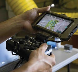 Luke Travisano, engineer with Robotic Research LLC, conducts a test run of the autonomous system Pegasus, during the Project Convergence capstone event at Yuma Proving Ground, Ariz. Luke Travisano, engineer with Robotic Research LLC, conducts a test run of the autonomous system Pegasus, during the Project Convergence capstone event at Yuma Proving Ground, Ariz.