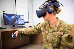 Air Force Staff Sgt. Renee Scherf, curriculum engineer, demonstrates a virtual reality training system that uses AI at Joint Base San Antonio in Texas.