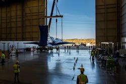 The X-59 is lowered to the ground at Lockheed Martin’s Skunk Works facility in Palmdale, California following a crane operation to remove it from the back of its transport. The X-59 is lowered to the ground at Lockheed Martin’s Skunk Works facility in Palmdale, California following a crane operation to remove it from the back of its transport.
