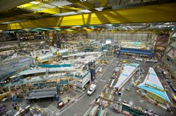 Boeing workers fabricate 777 aircraft in the company's factory. Boeing workers fabricate 777 aircraft in the company's factory.
