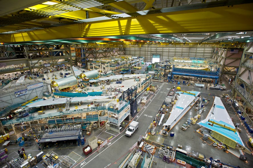 Boeing workers fabricate 777 aircraft in the company&apos;s factory.