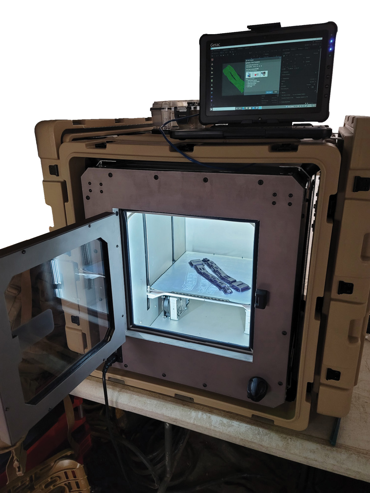 The Craitor 3D printer finishing a nylon print in a U.S. Marine Corps field exercise aboard the MCMWTC Bridgeport in the High-Sierra mountain range.