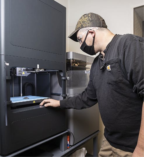 Jeff Thompson, toolmaker supervisor, operates a 3D printer in the machine and weld shop at Anniston Army Depot an Anniston, Ala.
