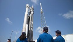 NASA astronauts Suni Williams, left, Barry &apos;Butch&apos; Wilmore, center, and Mike Fincke, right, watch as a United Launch Alliance Atlas V rocket with Boeing&rsquo;s CST-100 Starliner spacecraft aboard is rolled out of the Vertical Integration Facility to the launch pad at Space Launch Complex 41 ahead of the Orbital Flight Test-2 (OFT-2) mission, Wednesday, May 18, 2022, at Cape Canaveral Space Force Station in Florida.