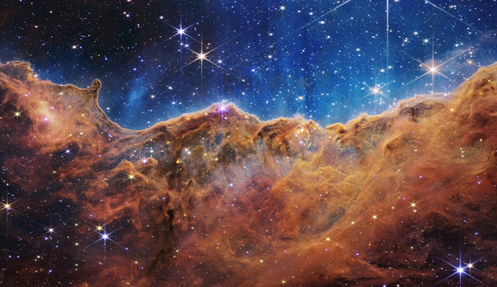 This landscape of &ldquo;mountains&rdquo; and &ldquo;valleys&rdquo; speckled with glittering stars is actually the edge of a nearby, young, star-forming region called NGC 3324 in the Carina Nebula. Captured in infrared light by NASA&rsquo;s new James Webb Space Telescope, this image reveals for the first time previously invisible areas of star birth.