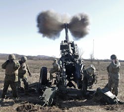 A Marine artillery gun crew fires an M777 howitzer during a training exercise at Quanah Range on Fort Sill, Okla. The Precision Guidance Kit (PGK) &ldquo;smart&rdquo; fuzes were installed on 155-millimeter shells fired from the howitzers. U.S. Army photo.