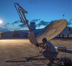 Staff Sgt. Trevor Black, 821st Contingency Response Support Squadron small package initial communications element technician, checks wires on a satellite communication antenna at Roosevelt Roads, Puerto Rico. Air Force photo. Staff Sgt. Trevor Black, 821st Contingency Response Support Squadron small package initial communications element technician, checks wires on a satellite communication antenna at Roosevelt Roads, Puerto Rico. Air Force photo.