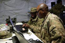 Army cyber security experts check the status of an Army network.