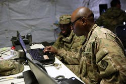 Army cyber security experts check the status of an Army network. Army cyber security experts check the status of an Army network.