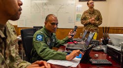 U.S. Air Force mobile data manager, supervises Airborne Extensible Relay Over-Horizon Network integration for Royal Thai Air Force Flying Officer Apisit Kitchoke at Moody Air Force Base, Ga.