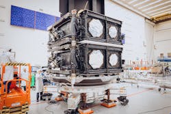 Boeing team members prepare the first two O3b mPOWER satellites for containerization ahead of delivery to satellite operator SES.