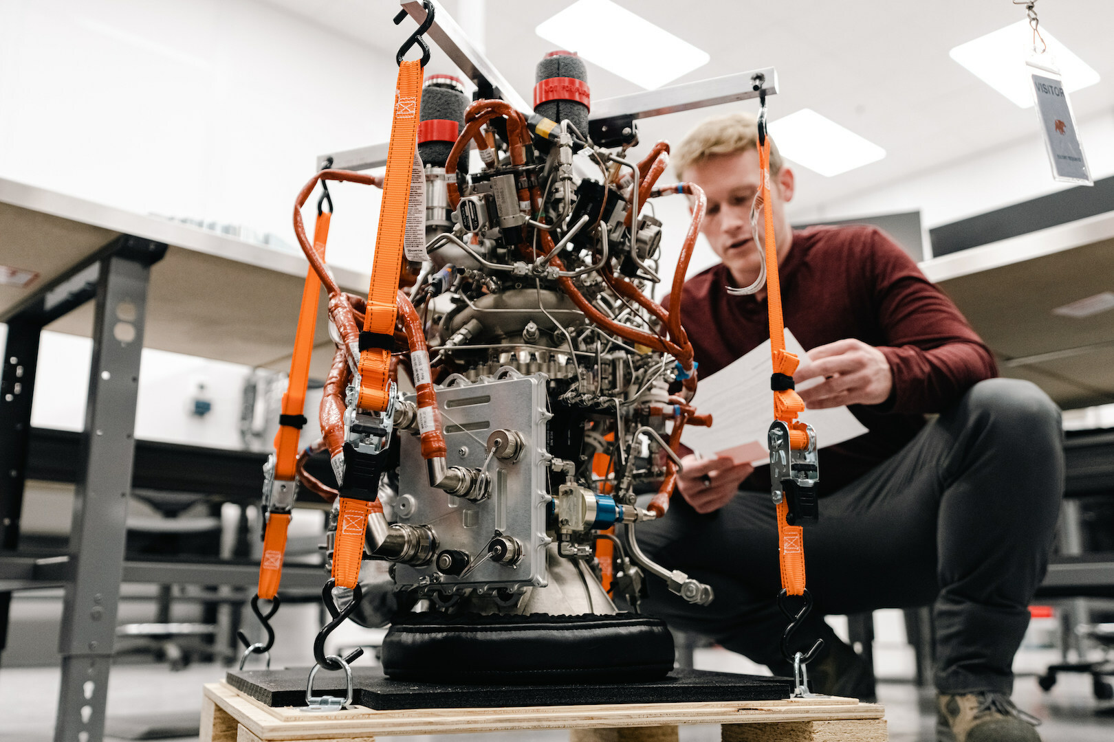 Jordan Forness, Vehicle Operations Manager at Ursa Major, reviews a Hadley engine before it ships to Astra. Ursa Major photo.