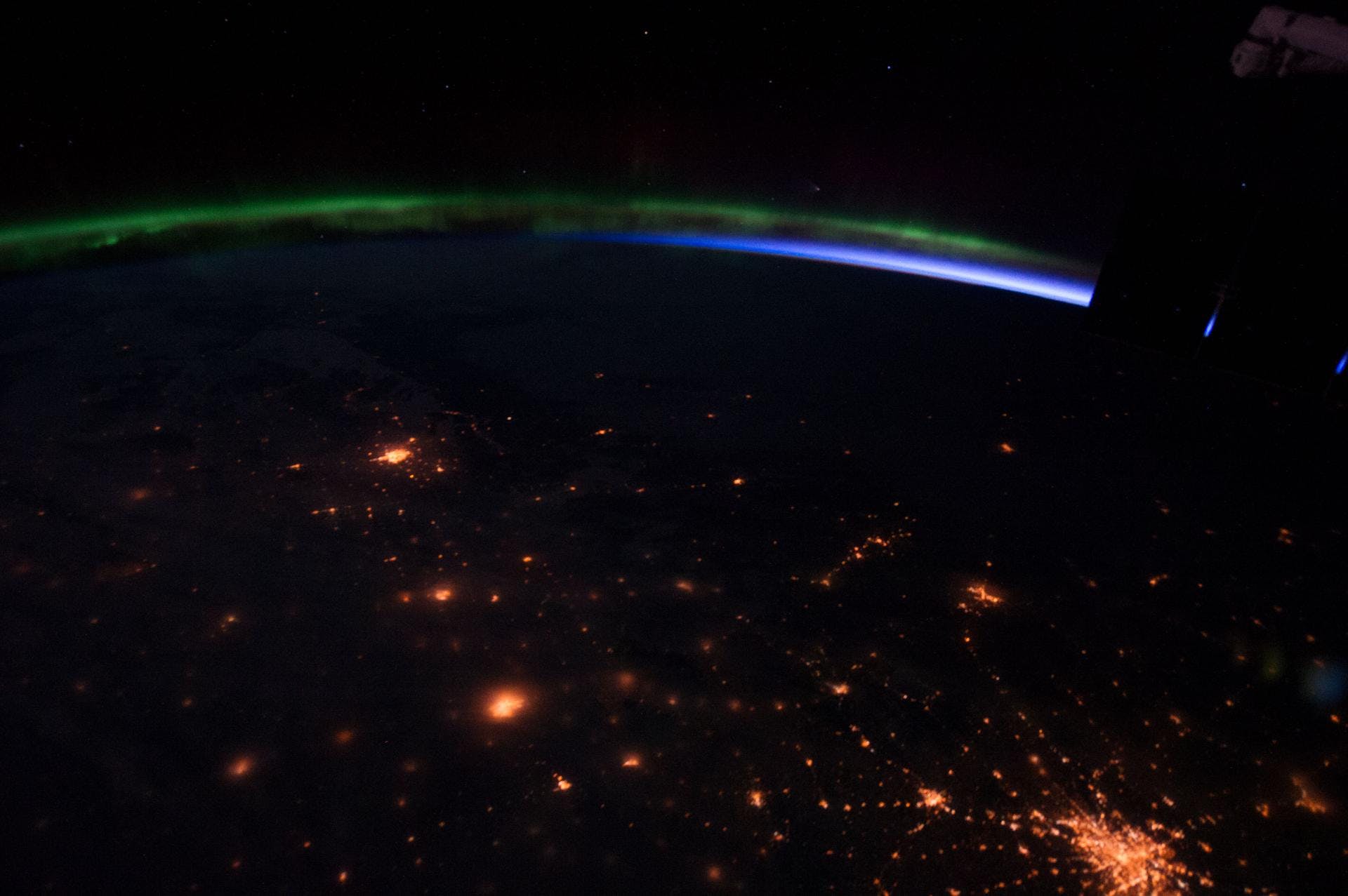 A view of the Earth with Aurora Borealis and an orbital sunrise taken by the Expedition 35 crew aboard the International Space Station. NASA photo.