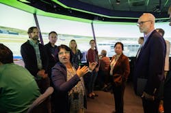 Savvy Verma, left, and Huy Tran, director of aeronautics at NASA’s Ames Research Center in California’s Silicon Valley, center, explain a recent air traffic management simulation to guests at Ames’ FutureFlight Central simulator. Credit: NASA/Jesse Carpenter Savvy Verma, left, and Huy Tran, director of aeronautics at NASA’s Ames Research Center in California’s Silicon Valley, center, explain a recent air traffic management simulation to guests at Ames’ FutureFlight Central simulator. Credit: NASA/Jesse Carpenter