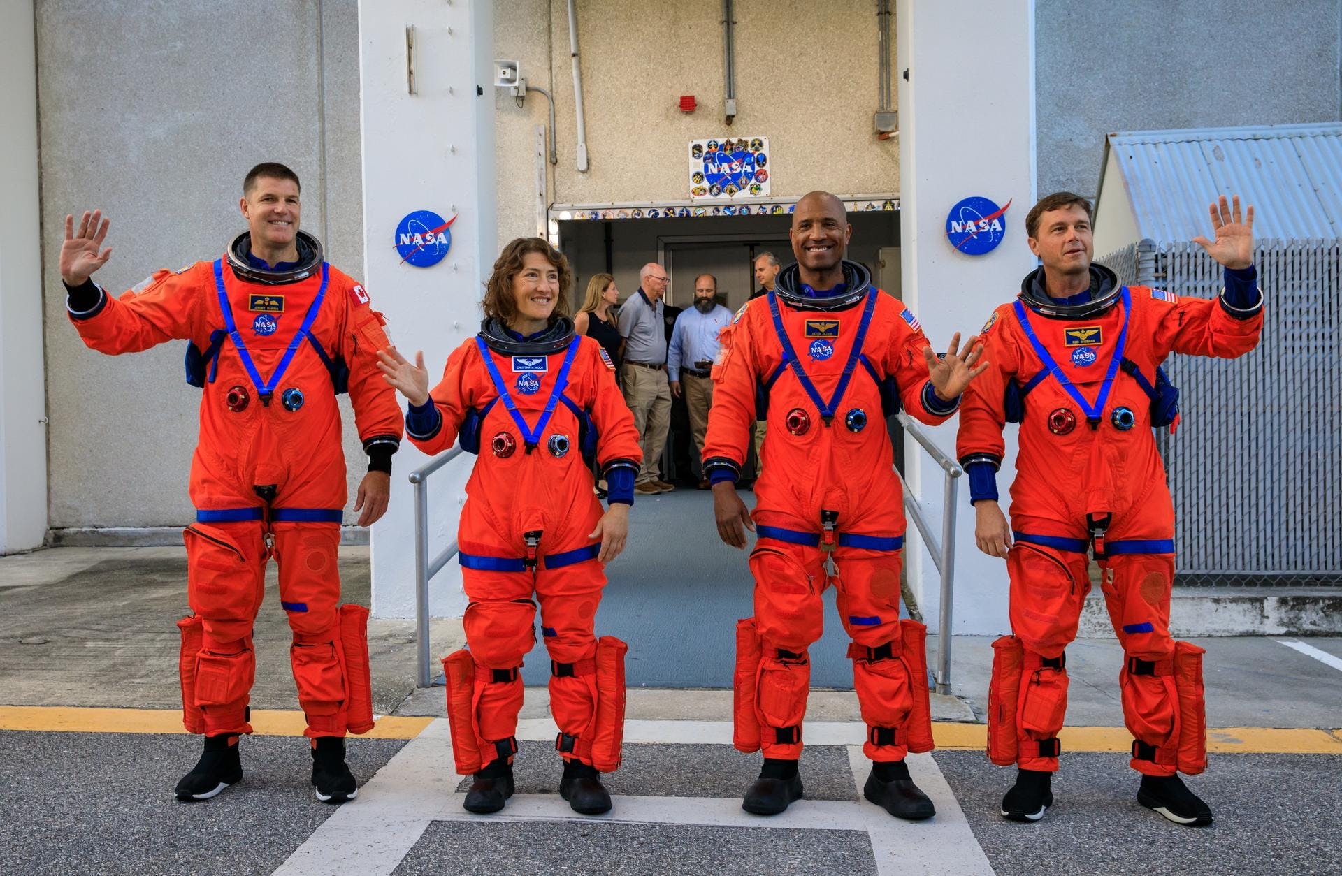 Artemis II crew members (from left) CSA (Canadian Space Agency) astronaut Jeremy Hansen, and NASA astronauts Christina Koch, Victor Glover, and Reid Wiseman walk out of Astronaut Crew Quarters inside the Neil Armstrong Operations and Checkout Building to the Artemis crew transportation vehicles prior to traveling to Launch Pad 39B as part of an integrated ground systems test at Kennedy Space Center in Florida on Wednesday, Sept. 20, to test the crew timeline for launch day. NASA photo.