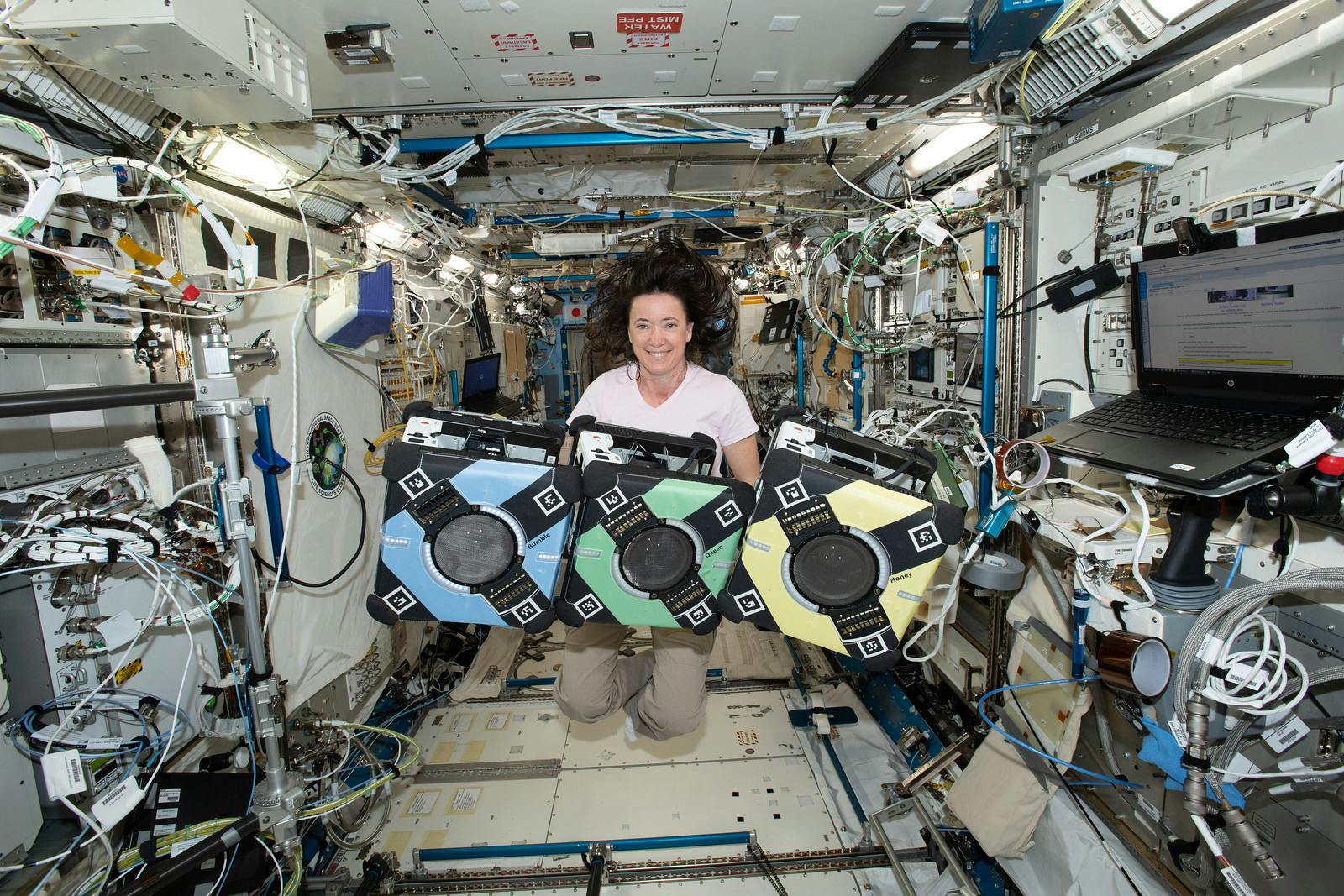 NASA astronaut Megan McArthur with the Astrobee robotic free-flyers. NASA photo.