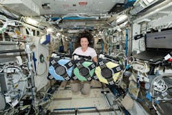 NASA astronaut Megan McArthur with the Astrobee robotic free-flyers. NASA photo.