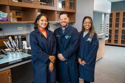 A photo of a team of researchers from the University of Puerto Rico-Río Piedras while working to discover a more efficient water recycling system for use on space missions. The team is comprised of doctoral students Liz Santiago-Martoral, on the left, and Alondra Rodriguez-Rolon, and their mentor Professor Eduardo Nicolau. One of their experiments can be seen on the countertop to the left of the group. NASA photo. A photo of a team of researchers from the University of Puerto Rico-Río Piedras while working to discover a more efficient water recycling system for use on space missions. The team is comprised of doctoral students Liz Santiago-Martoral, on the left, and Alondra Rodriguez-Rolon, and their mentor Professor Eduardo Nicolau. One of their experiments can be seen on the countertop to the left of the group. NASA photo.