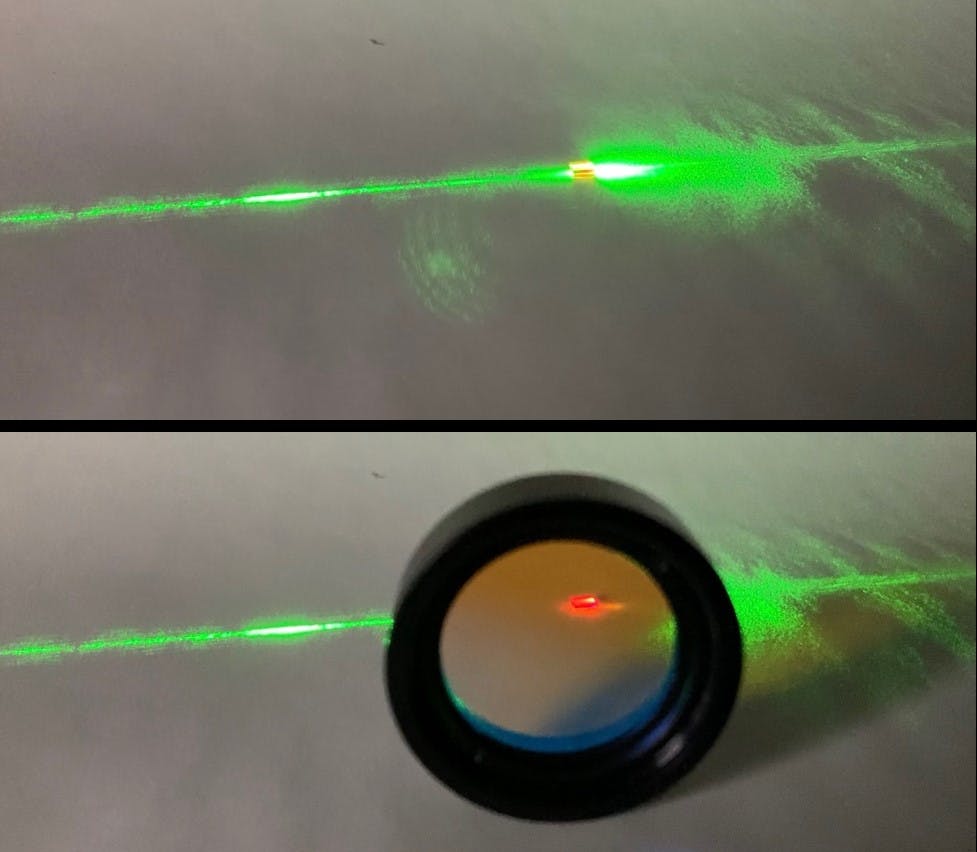 The heart of optically pumped quantum magnetometers: a diamond crystal enriched with color centers. Unlike many other quantum systems, diamond and SiC solid state quantum color centers operate at room temperature and can be readily accessed electrically or optically. The bottom photo, filtering the laser light for the observer, shows the red-shifted emission response of the quantum system. This response is encoded with quantum spin information, and can be used to read environmental influences, such as temperature, pressure, electric and, most importantly for us, magnetic field properties. Image credit A. Gottscholl/ NASA/JPL-Caltech.