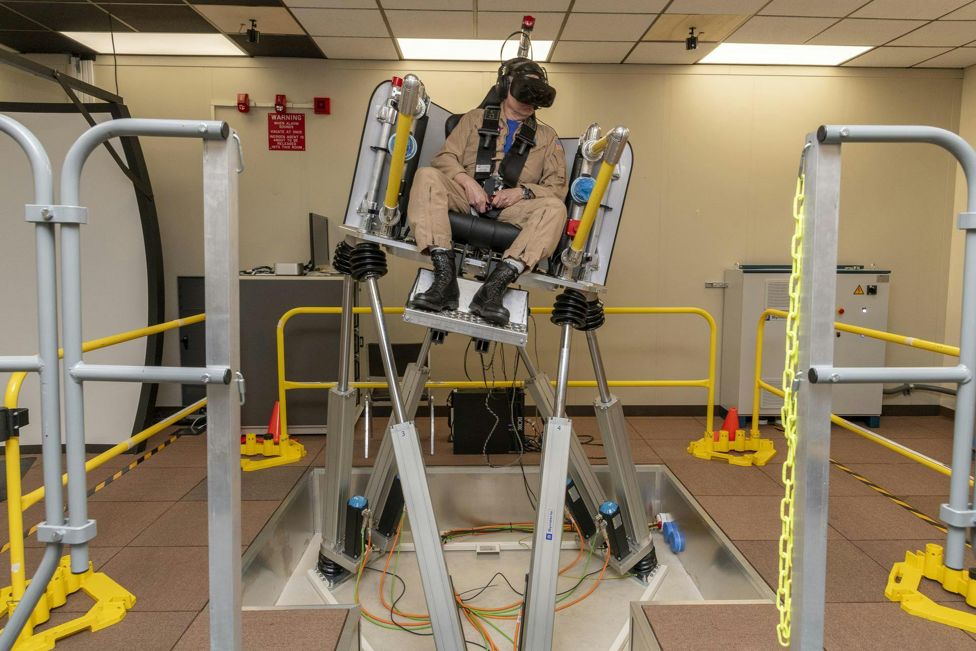 NASA test pilot Wayne Ringelberg sits in the air taxi virtual reality flight simulator during a test at NASA&rsquo;s Armstrong Flight Research Center in Edwards, California, in March 2024. NASA/Steve Freeman photo.