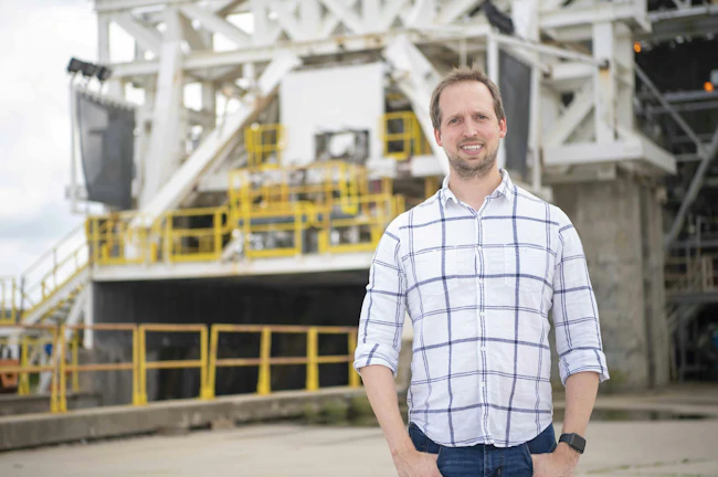 Chris Barnett-Woods is shown at the E-1 Test Stand at NASA&rsquo;s Stennis Space Center near Bay St. Louis, Mississippi, where NASA Stennis accelerates the exploration and commercialization of space and innovates to benefit NASA and industry. NASA/Danny Nowlin photo.