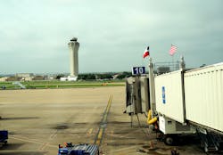 Texas and American flags fly above waiting jetway at Austin-Bergstrom airport. Air traffic control tower is in the background. Photo 56407993 © Linda Williams | Dreamstime.com Texas and American flags fly above waiting jetway at Austin-Bergstrom airport. Air traffic control tower is in the background. Photo 56407993 © Linda Williams | Dreamstime.com