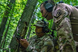 A U.S. Army electromagnetic warfare (EW) specialist helps a colleague with the 10th Mountain Division Artillery Brigade calibrate EW equipment at Fort Drum, N.Y. Army photo A U.S. Army electromagnetic warfare (EW) specialist helps a colleague with the 10th Mountain Division Artillery Brigade calibrate EW equipment at Fort Drum, N.Y. Army photo