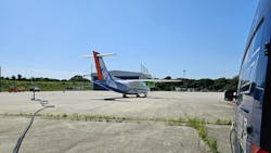 A measuring probe was permanently installed at Oberpfaffenhofen Airport for the emission measurements. While the pilot runs through the various thrust stages of the LTO cycle (Landing and Take-Off Cycle) with the aircraft on the ground, the probe takes exhaust gas samples and sends them to the mobile laboratory of the DLR Institute of Combustion Technology, which is located at a safe distance from the aircraft. Credit: DLR (CC BY-NC-ND 3.0) A measuring probe was permanently installed at Oberpfaffenhofen Airport for the emission measurements. While the pilot runs through the various thrust stages of the LTO cycle (Landing and Take-Off Cycle) with the aircraft on the ground, the probe takes exhaust gas samples and sends them to the mobile laboratory of the DLR Institute of Combustion Technology, which is located at a safe distance from the aircraft. Credit: DLR (CC BY-NC-ND 3.0)