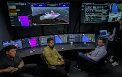 NASA and partners from Aerostar and AeroVironment discuss a simulation of a high-altitude air traffic management system for vehicles flying 60,000 feet and above in the Airspace Operations Lab (AOL) at NASA’s Ames Research Center in California’s Silicon Valley. NASA/Don Richey photo. NASA and partners from Aerostar and AeroVironment discuss a simulation of a high-altitude air traffic management system for vehicles flying 60,000 feet and above in the Airspace Operations Lab (AOL) at NASA’s Ames Research Center in California’s Silicon Valley. NASA/Don Richey photo.