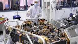 In a clean room at NASA’s Jet Propulsion Laboratory in Southern California in October 2023, scientist Vanessa Bailey stands behind the Roman Coronagraph, which has been undergoing testing at the lab. Designed to block starlight and allow scientists to see the faint light from planets outside our solar system, the Coronagraph is a technology demonstration that will be part of the Roman telescope. NASA/JPL-Caltech photo. In a clean room at NASA’s Jet Propulsion Laboratory in Southern California in October 2023, scientist Vanessa Bailey stands behind the Roman Coronagraph, which has been undergoing testing at the lab. Designed to block starlight and allow scientists to see the faint light from planets outside our solar system, the Coronagraph is a technology demonstration that will be part of the Roman telescope. NASA/JPL-Caltech photo.